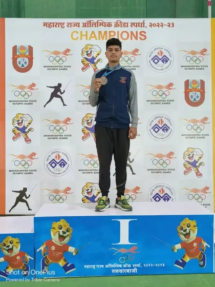 One of our warriors on the winner's podium at the Maharashtra State Olympic Games. This image captures the culmination of years of hard work and dedication.