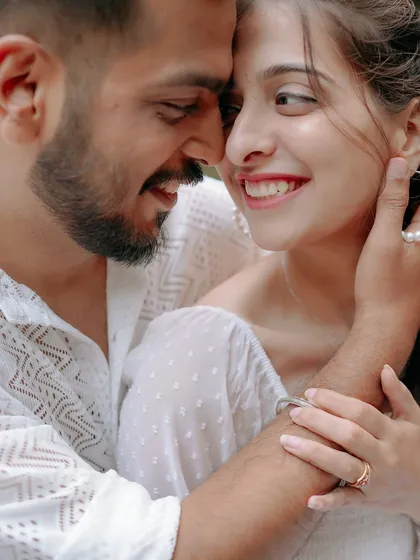 A beautiful close-up of a couple's happy and intimate moment during a waterfall shoot. The genuine smiles and gentle touch showcase the real connection I aim to capture.