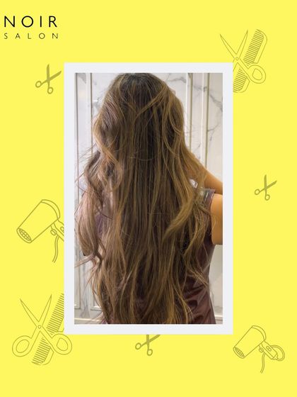 This image captures the beauty of long, healthy, styled hair. After a treatment and styling session, these waves look effortlessly glamorous and full of life.