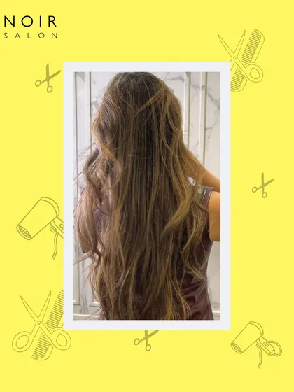 This image captures the beauty of long, healthy, styled hair. After a treatment and styling session, these waves look effortlessly glamorous and full of life.