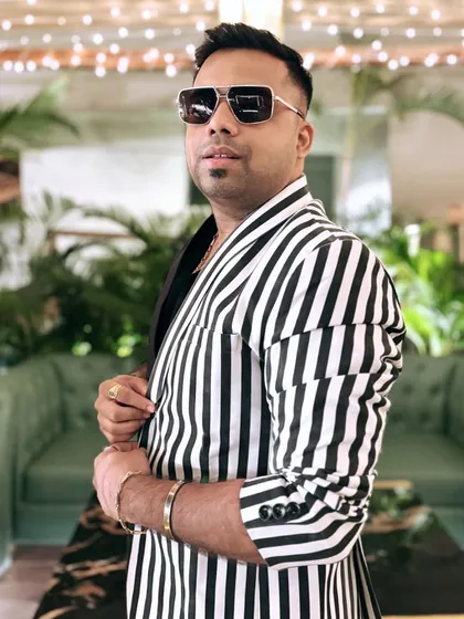 A close-up profile shot showcasing the details of my striped jacket. I believe that looking sharp and professional is a key part of being a great emcee.