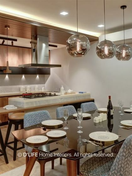 A wide shot of the open-concept living, dining, and kitchen areas. The consistent use of wood tones and modern lighting unifies the entire space.