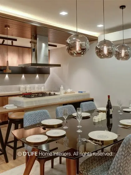 A wide shot of the open-concept living, dining, and kitchen areas. The consistent use of wood tones and modern lighting unifies the entire space.