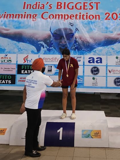Prapti Ghose on the podium after becoming the fastest swimmer in the history of Haryana Swimming. She surpassed a record set by a 5-time SGFI National Gold Medalist.