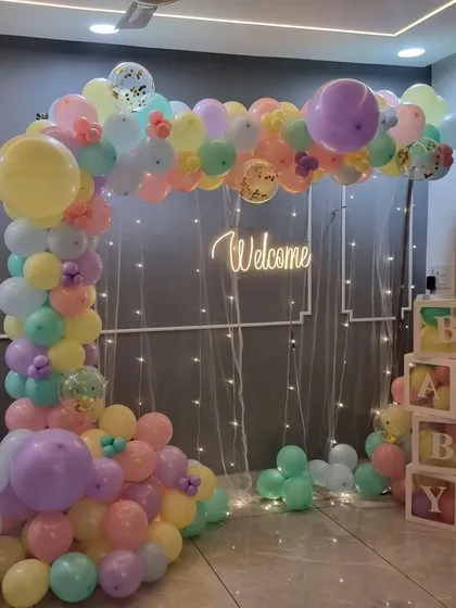 A full shot of the pastel welcome home balloon arch, perfect for brightening up any room.