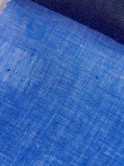 A bright blue linen-blend fabric, offering a more casual and textured look for summer blazers or shirts.