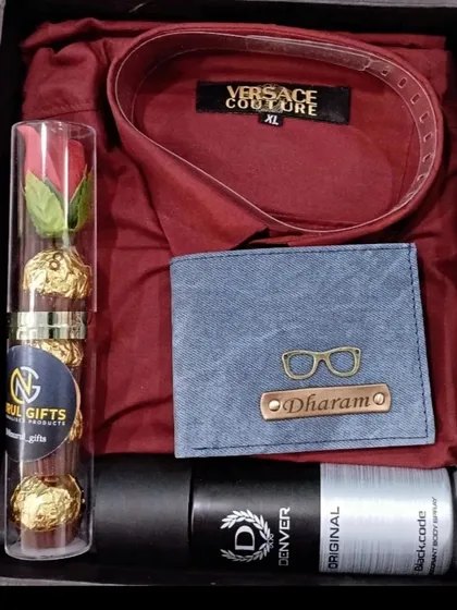 A festive gift hamper perfect for any celebration, this set includes a personalized denim wallet, a maroon shirt, deodorant, and chocolates.