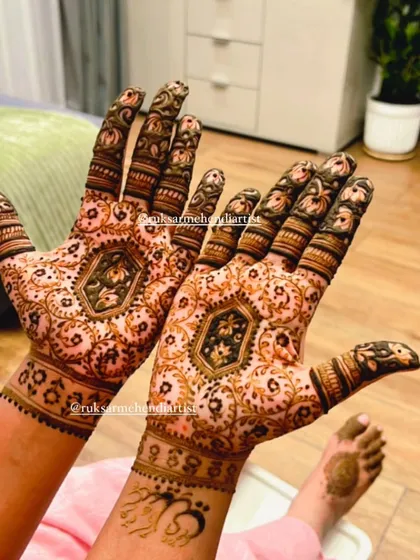 Another view of the lotus-themed bridal mehendi, showing how the design looks from a different angle.