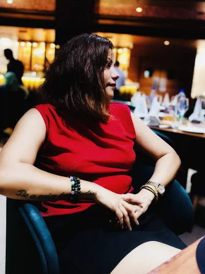 A similar candid moment from the same dinner, capturing a natural and relaxed mood.