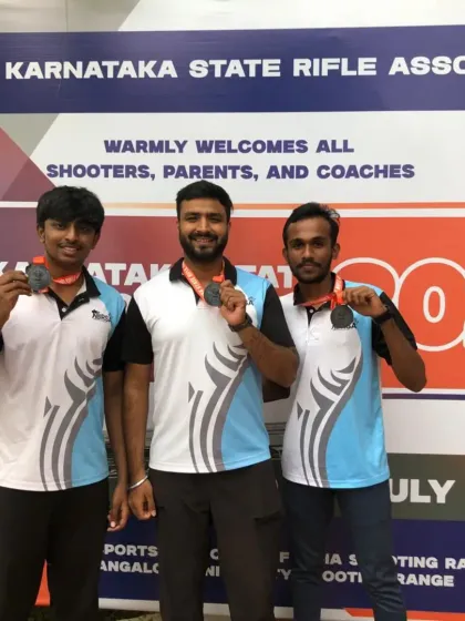 Darshan, Shivam, and Bhojaraj with their bronze medals from the Men's ISSF Rifle Team event. Their teamwork and precision earned them a well deserved spot on the podium at the state championship.