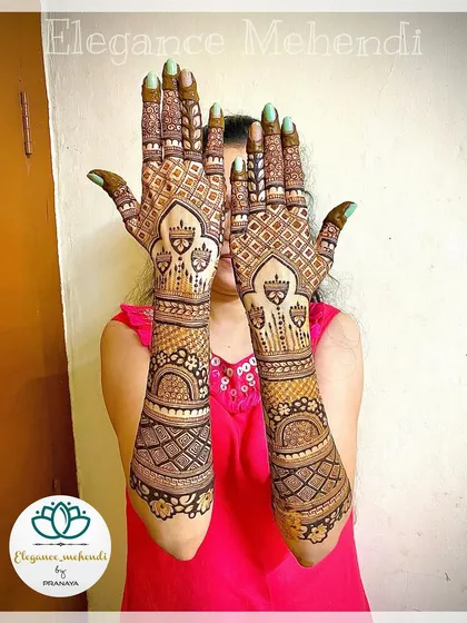 A full backhand bridal design with intricate check patterns covering the entire hand and detailed bands extending up the arm.