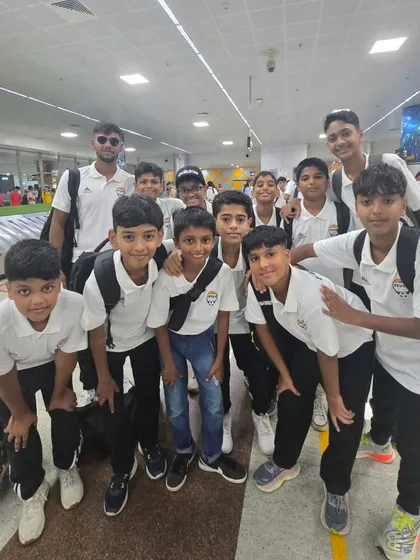 A group of our younger players with their coach at the airport, full of energy.