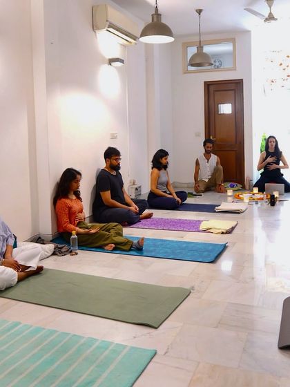 A group breathwork session in progress. In this safe and guided environment, participants are encouraged to surrender to their breath and allow the healing process to unfold.
