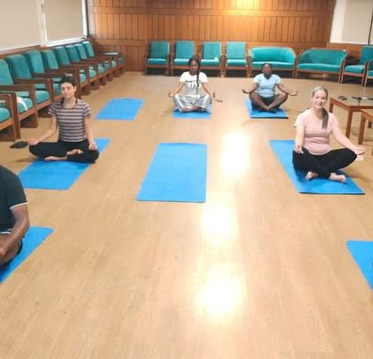 The same group of international students in a moment of quiet meditation. Our courses attract a diverse community of practitioners, all united in their quest for deeper yogic knowledge.