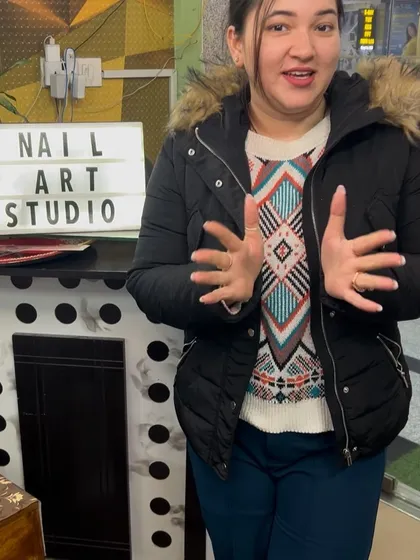 A happy client showing off her fresh, clean French manicure at my nail art studio.
