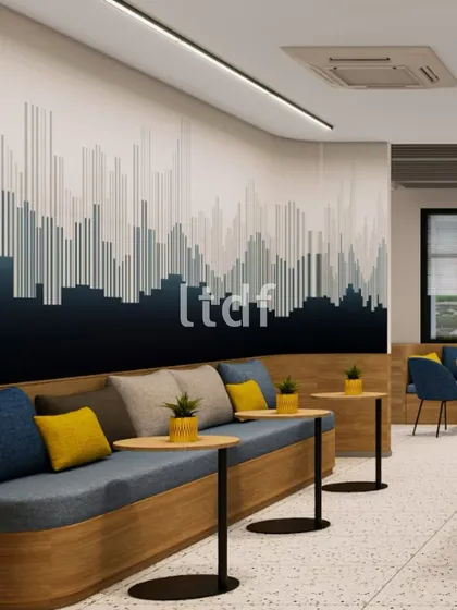 A harmonious blend of muted greys, deep blues, and vibrant yellow accents balances calm and energy in this office lounge. The linear wall graphic adds rhythm, while terrazzo flooring and warm wood finishes ground the modern aesthetic.