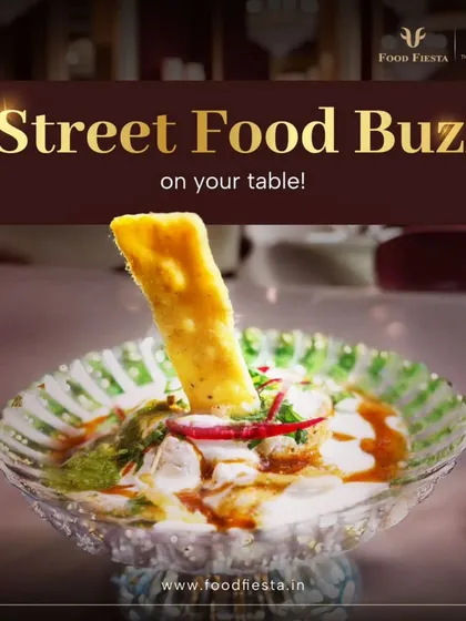 A delightful serving of Paapdi Chaat in a crystal bowl. The combination of crunchy paapdi, creamy yogurt, and tangy chutneys creates a burst of flavour in every bite.