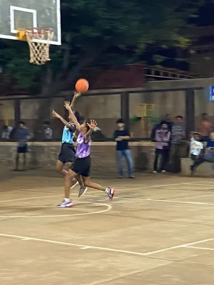 A contested layup during a women's eliminator match. Every basket matters when it's win or go home.
