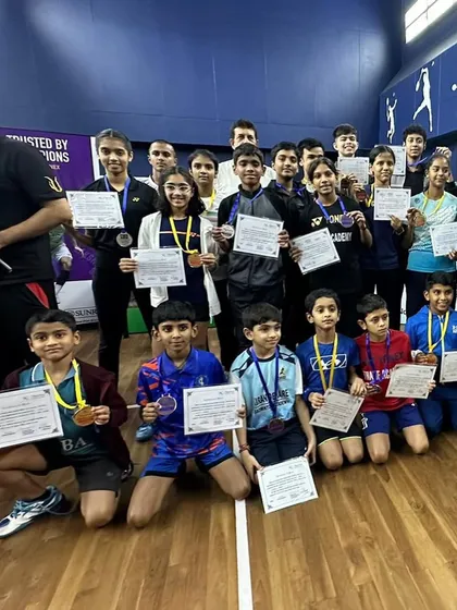 A court full of winners. Our young players, including gold medalist Ajinkya Desai, celebrating their victories at the Manora Badminton Academy tournament.