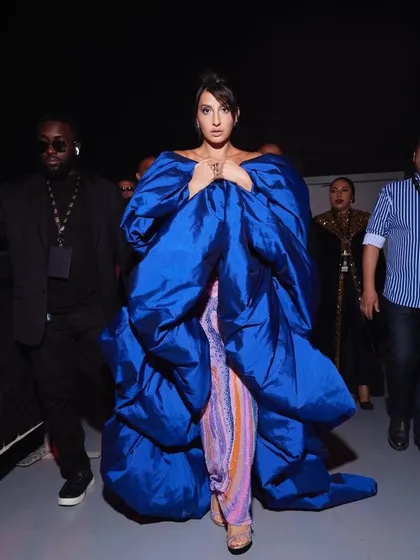 For Nora Fatehi's main IIFA 2023 appearance, we went for high drama with this structural Jean-Pierre Khoury gown. The voluminous royal blue wrap over a psychedelic-print catsuit was a bold fashion choice that truly owned the carpet.