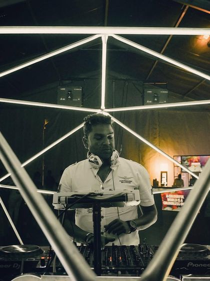 In the middle of a geometric light installation. The production at this event was next-level, creating a truly immersive visual and auditory experience.