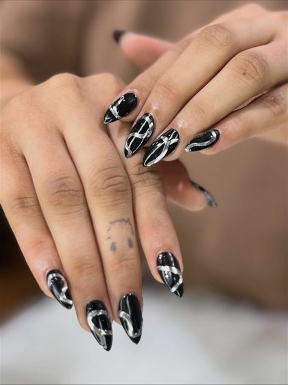 The black and silver 3D art from another perspective, highlighting the glossy finish.