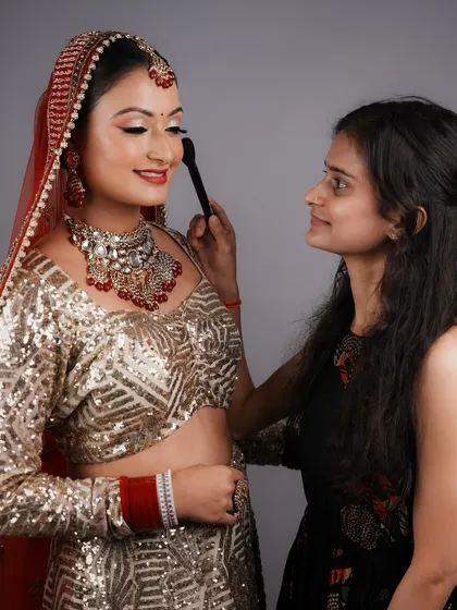 A beautiful moment between a student and her model. My training focuses not just on technique, but also on building a gentle and professional rapport with clients.
