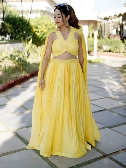 This vibrant yellow lehenga with a cape was my favorite outfit for the Haldi season. It's bright, cheerful, and perfect for a sun-filled daytime celebration.