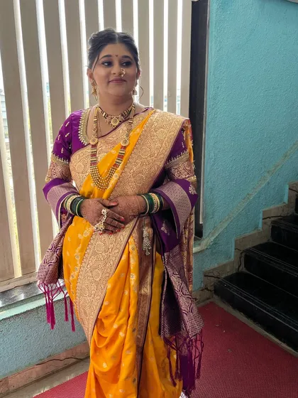 My bride Saloni, looking absolutely radiant in her yellow and purple Paithani saree. I provided the complete look, including makeup, hair, and draping.