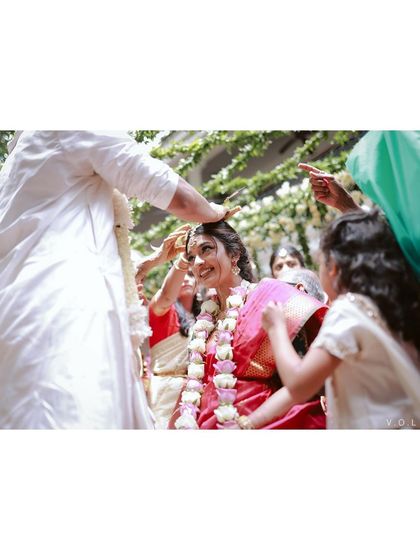 A candid moment from the Muhurtham ceremony, filled with blessings and happiness.