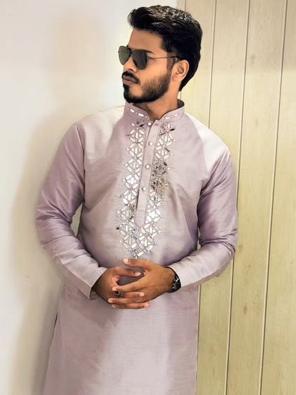 The lavender kurta with mirror work, styled with sunglasses for a cool, contemporary ethnic look.