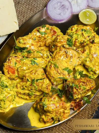 Our Chicken Peshawari Tandoori, marinated in traditional spices and cooked to perfection, offering a timeless taste.