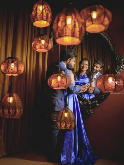 A creative shot in our royal room, using the mirror and hanging lamps to create a multi-layered and interesting portrait.