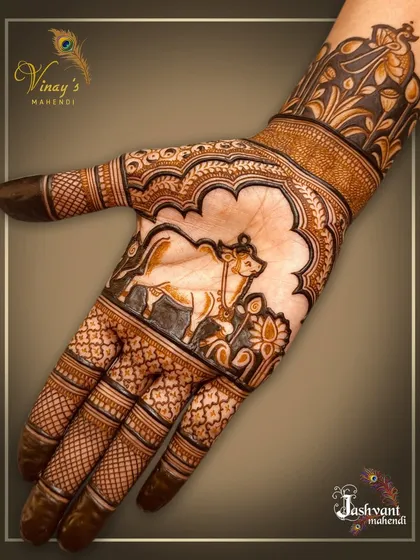 A single-hand view of the sacred cow design, showing the fine details in the animal portrait and surrounding patterns.