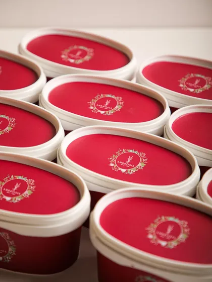 Our signature oval ice cream tubs, neatly stacked and ready for delivery. We ensure our desserts reach you with the same care they were made with.