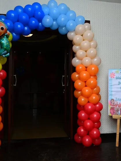 A Cocomelon-themed entrance arch at a restaurant, showing how we can transform a public space for a private party.