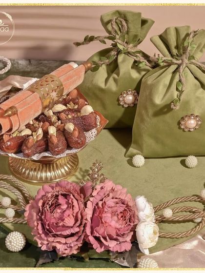 Ramadan Kareem. This elegant hamper features soft velvet potlis, a scroll, and a bowl of premium dates, making it a thoughtful and traditional gift for the holy month.