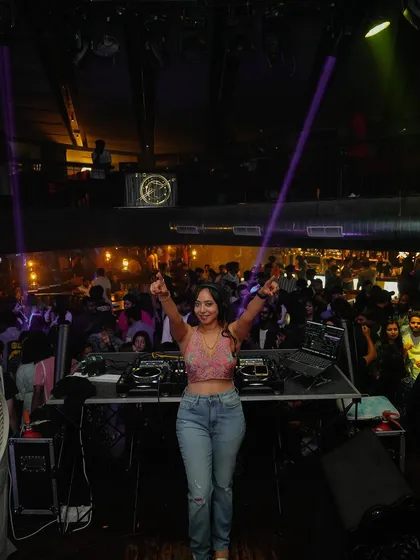 Celebrating a great set with the crowd. The feeling of a successful night with a happy audience is what makes being a professional DJ so rewarding.