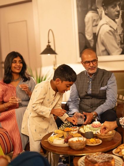 Even with family watching, the temptation of the Maska dessert table is too strong to resist.