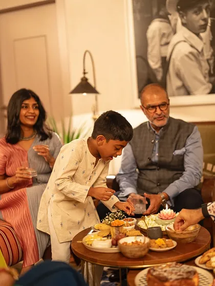 Even with family watching, the temptation of the Maska dessert table is too strong to resist.