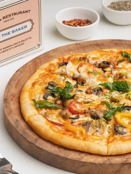Another angle of the Farmer House Veg Pizza, showing the generous toppings and perfectly baked crust.