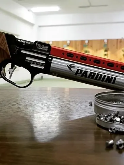I'm serious about my equipment. This is a Pardini air pistol, one of the best in the world. You'll be using professional-grade gear for your session, ensuring a true sport shooting experience.