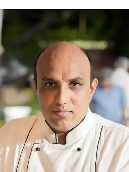 A portrait of one of our experienced head chefs, who leads the culinary team in creating memorable dining experiences.