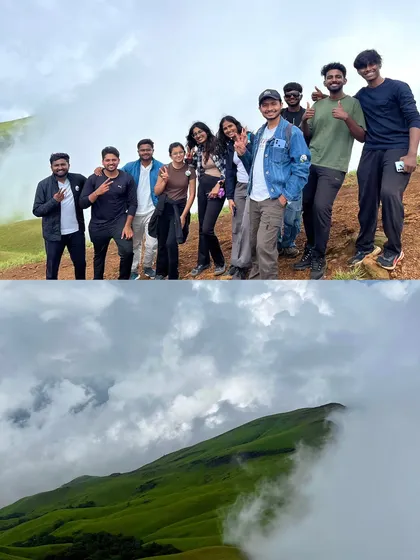 A group photo on the Netravati peak, with the clouds rolling in below. This is the classic Western Ghats view that everyone loves.