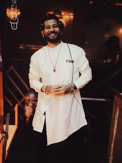 A stylish shot in a white asymmetrical kurta, bringing a touch of ethnic flair to the console.