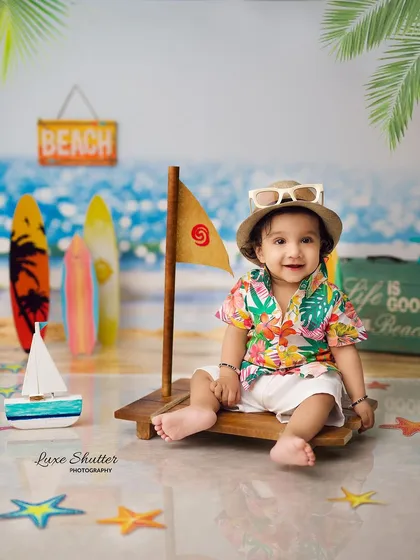 Another shot from our fun beach-themed session, this time with a cool hat and a happy smile.