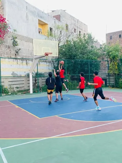A player goes up for a layup in a game situation.