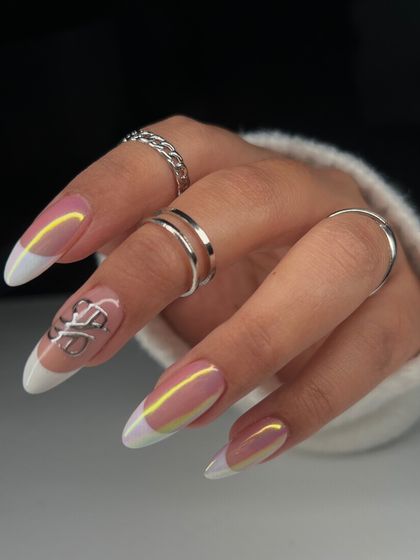 Another look at the chrome French manicure. The light catches the iridescent finish differently from every angle, making this a truly dynamic and eye-catching set.