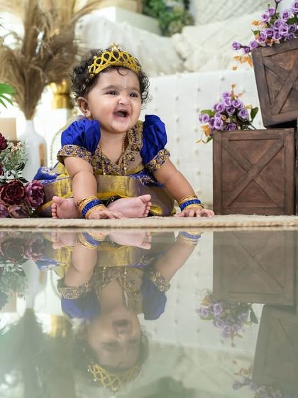 A joyful laugh from our little princess. The reflection on the floor adds a modern, artistic touch to this traditional portrait.