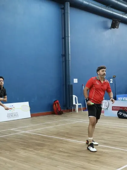 A doubles pair in action during the inter-club tournament. The image captures the dynamic movement and competitive spirit of the matches we organize.